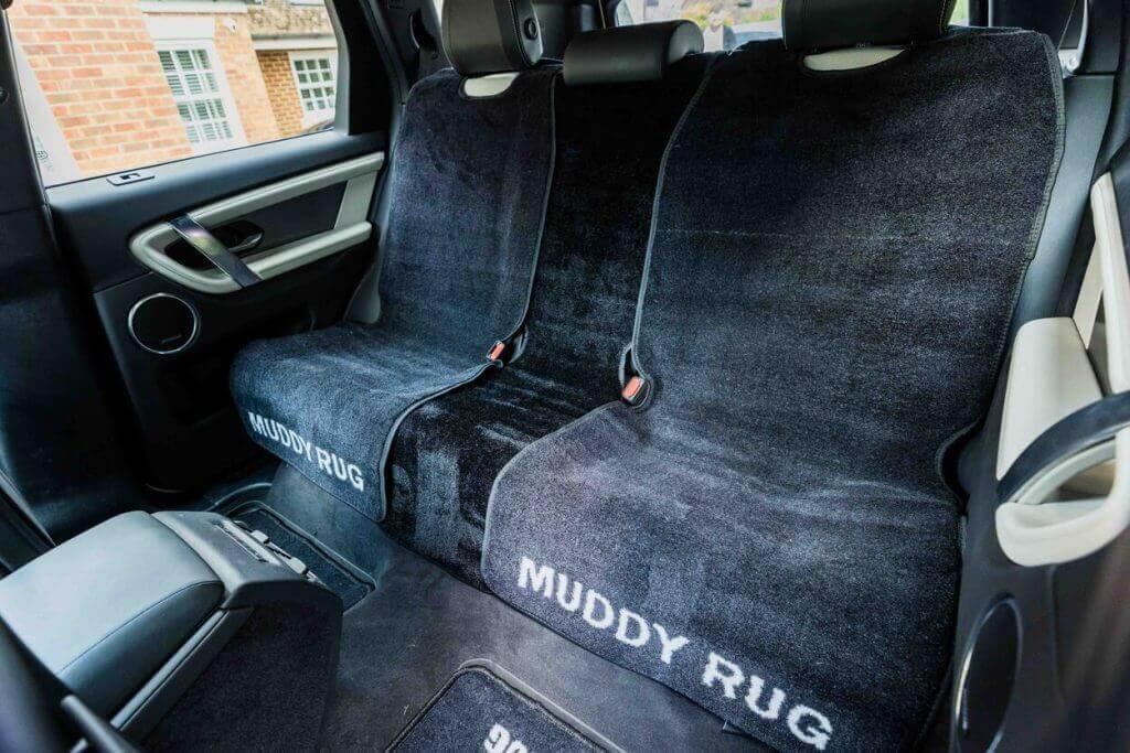 black seat covers fitted in the back of a car
