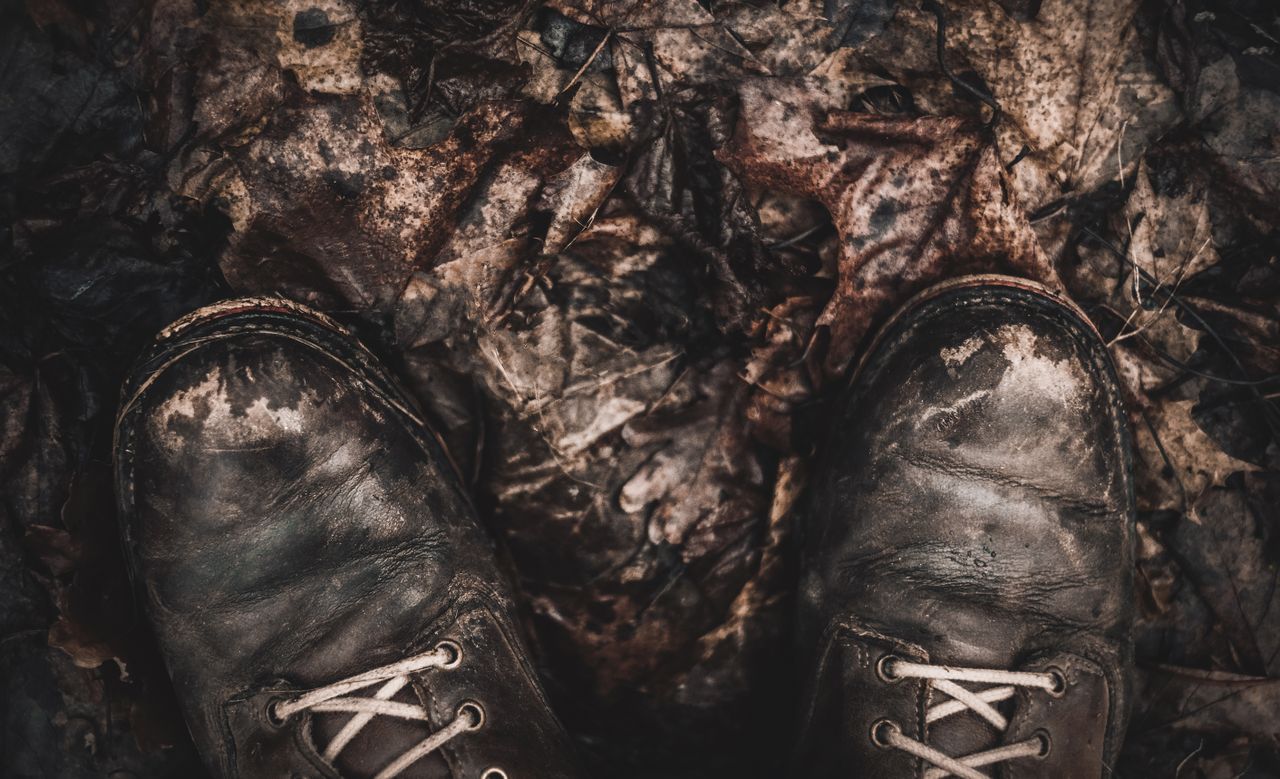 muddy brown leather boots